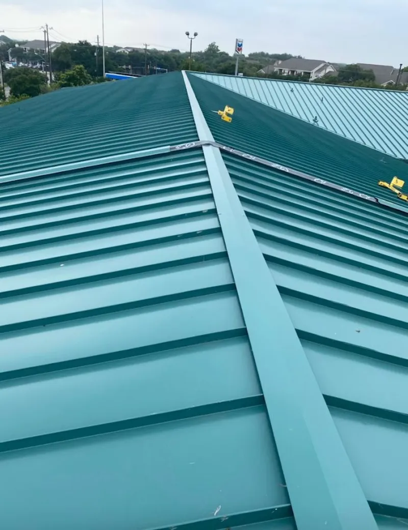 Green commercial metal roof ridge and valley for Metal Roof Repair in Saratoga Springs